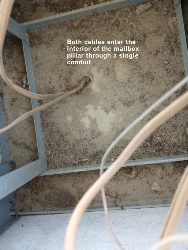  Inside mailbox pillar - two cables one conduit 